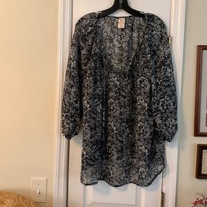 Top…black back ground with beige and green flowers.